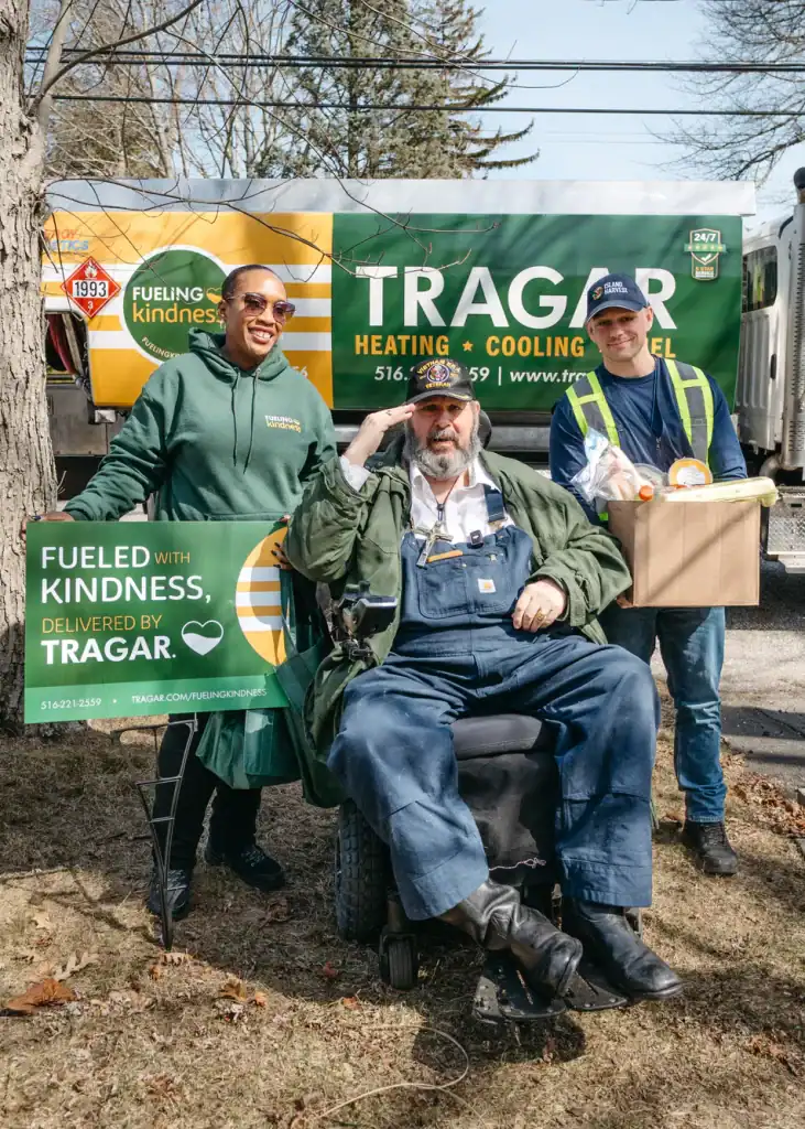 Diverse team volunteers delivering kindness to the community with TRAGAR.
